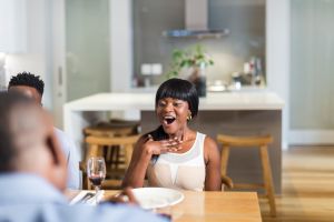 African man proposing to his girlfriend during dinner, Cape Town, South Africa