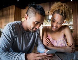 Couple at a cafe social networking