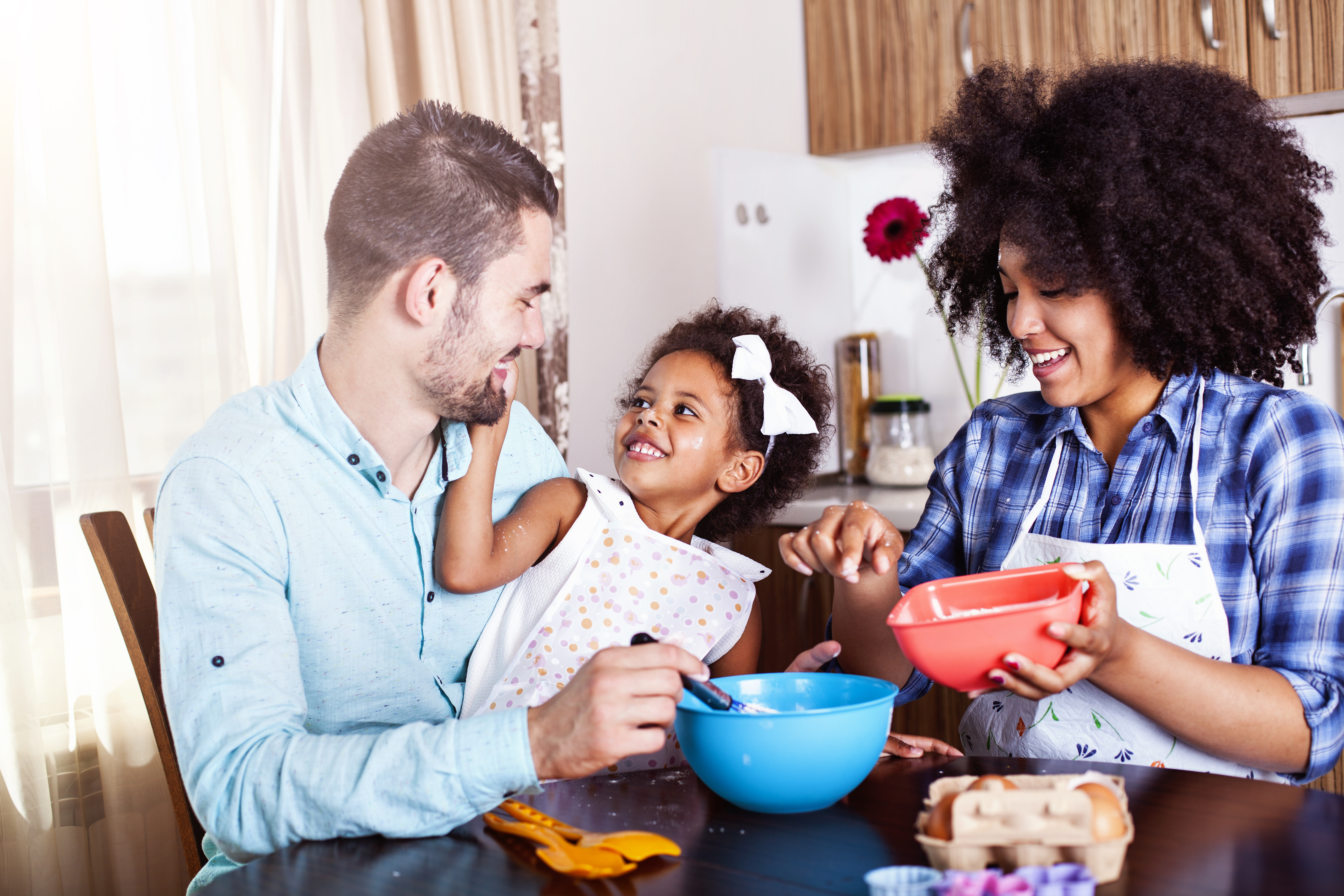 Young happy family baking together