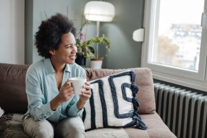 Beautiful African-American woman relaxing at home