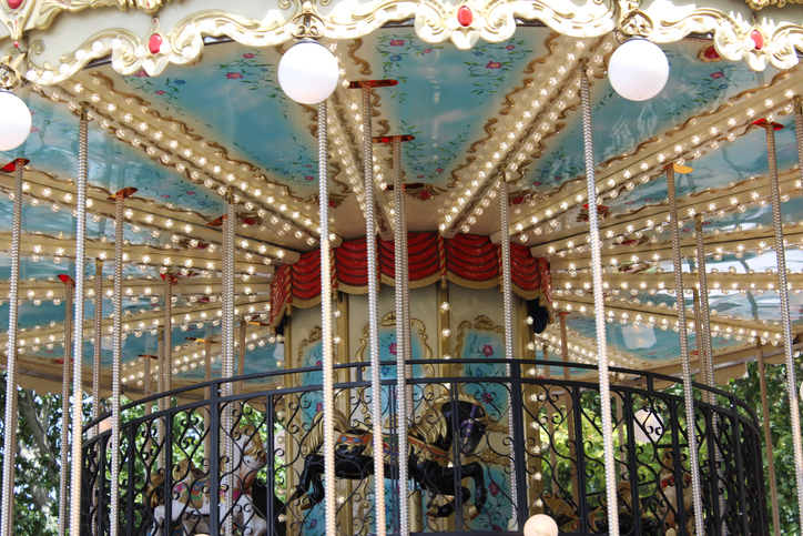 Low Angle View Of Illuminated Ferris Wheel In Building