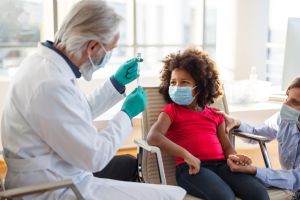 Young African-AMerican Girl Getting Ready For Coronavirus Vaccine