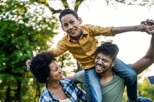 Young loving family having fun in the park
