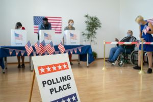 People voting and waiting to vote at a polling station