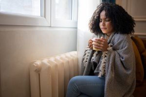 Woman feel cold in home with no heating