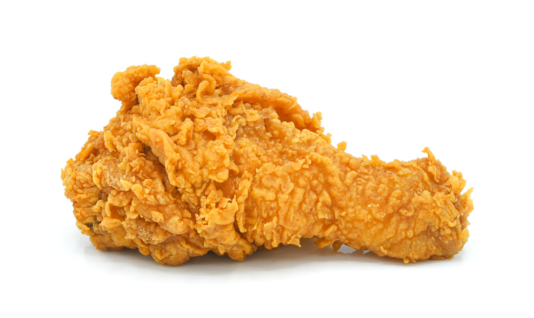 Fried chicken leg isolated on white