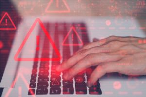 System hacked warning alert on notebook (Laptop). Cyber attack on computer network, Virus, Spyware, Malware or Malicious software. Cyber security and cybercrime. Compromised information internet.