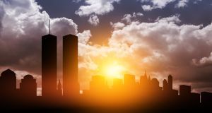 New York skyline silhouette with Twin Towers at sunset. American Patriot Day banner.
