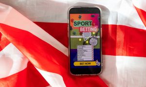 betting on sports, smart phone with working online betting mobile application