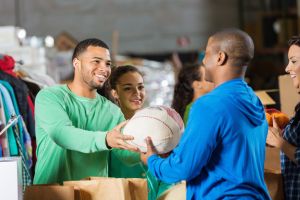 Man accepting turkey donation during holiday food drive