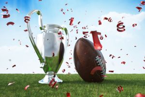 American Football with a Silver Trophy Cup on Grass Field