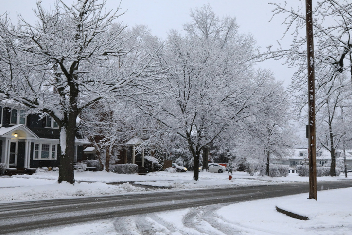 Residential street buried in snow after a blizzard storm