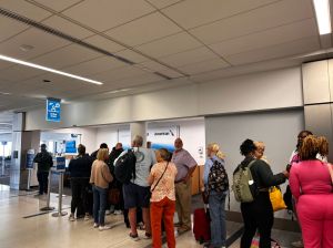Long lines of passengers trying to change flights after storm waiting in line at American Airlines Assist customer service station, Charlotte International Airport, North Carolina