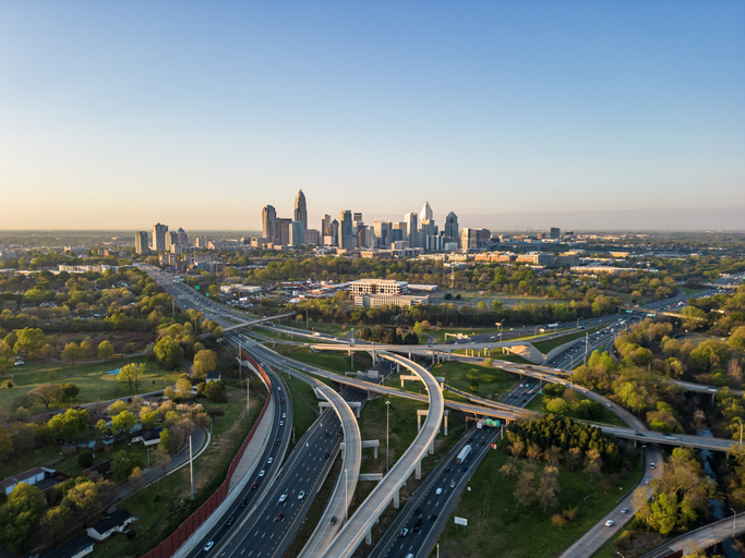 Charlotte NC Aerial | I-77 and I-485 Highways a Sunny Morning with Uptown Charlotte View